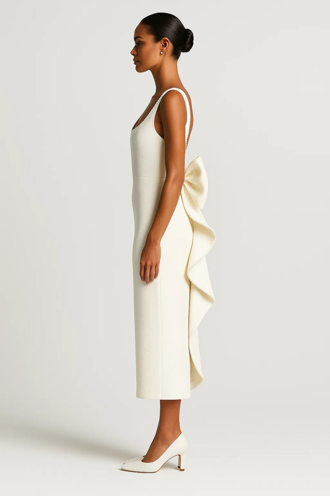 Elegant long dress with decorated neckline and back bow | Sophisticated ceremony style