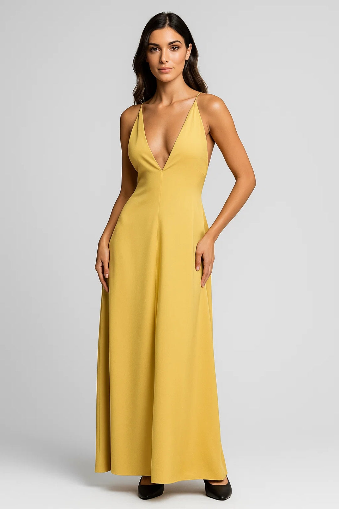 Long yellow dress with thin straps and an open back