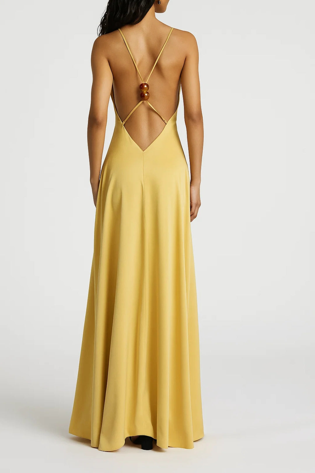 Long yellow dress with thin straps and an open back